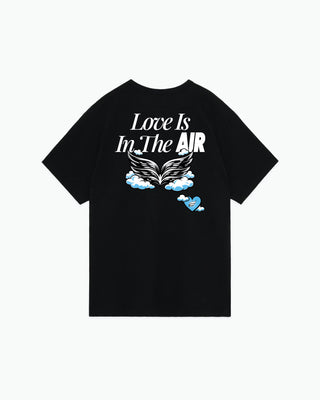 Black t-shirt with white text and winged graphic design on back