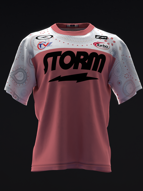 Front view of bowling jersey with mauve body and white paisley patterned sleeves, Storm logo prominent across chest with lightning bolt detail, multiple sponsor logos visible on shoulders and neckline.