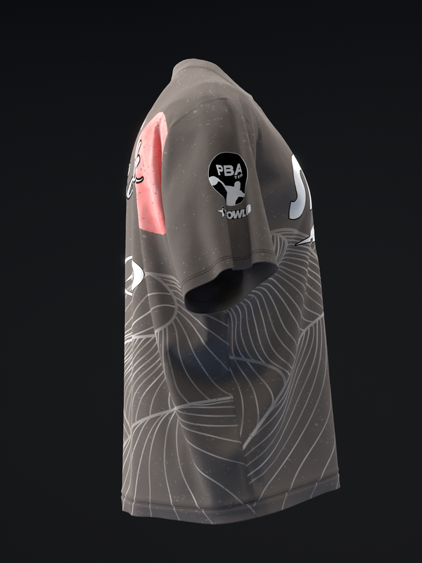 Black bowling jersey with white and pink geometric mountain line pattern, side view