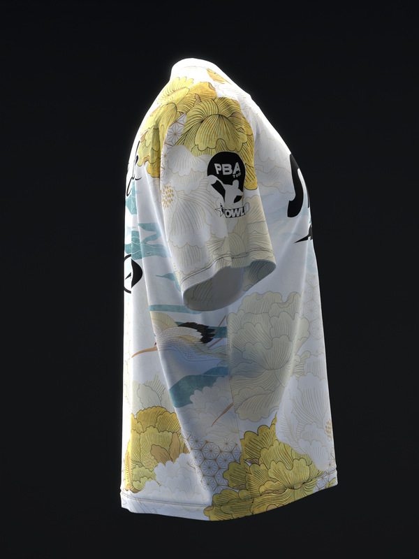 White bowling jersey with yellow and teal crane design, side view