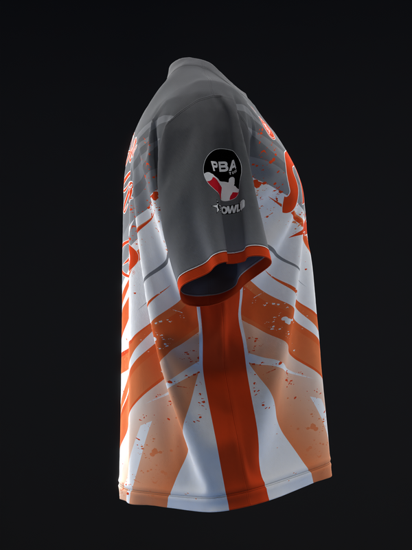 Orange and white bowling jersey with abstract splatter pattern design, side view
