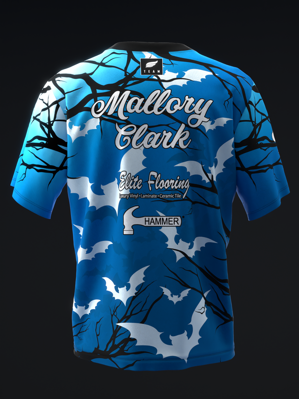 Blue bowling jersey with bat and branch design, front view