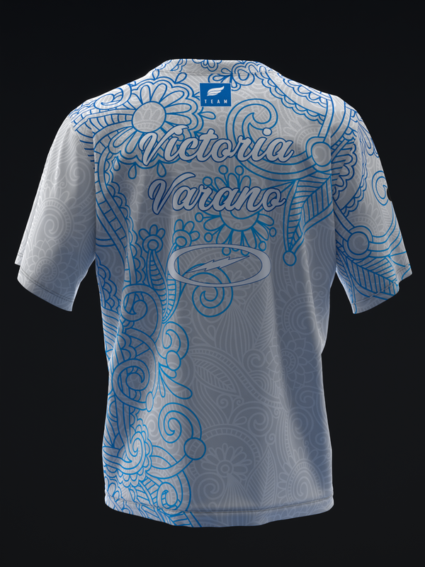White bowling jersey with blue ornate paisley and floral design, back view