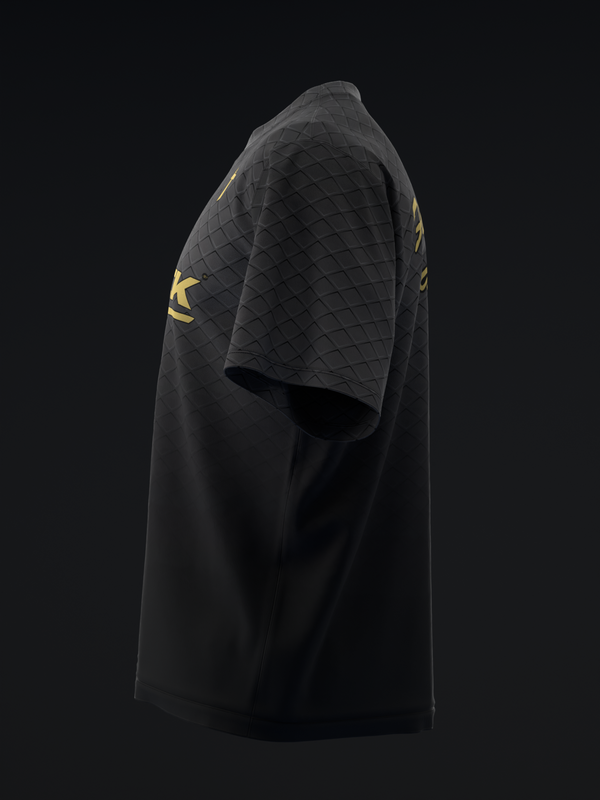 Black bowling jersey with quilted shoulder panel and gold graphic detail, side view