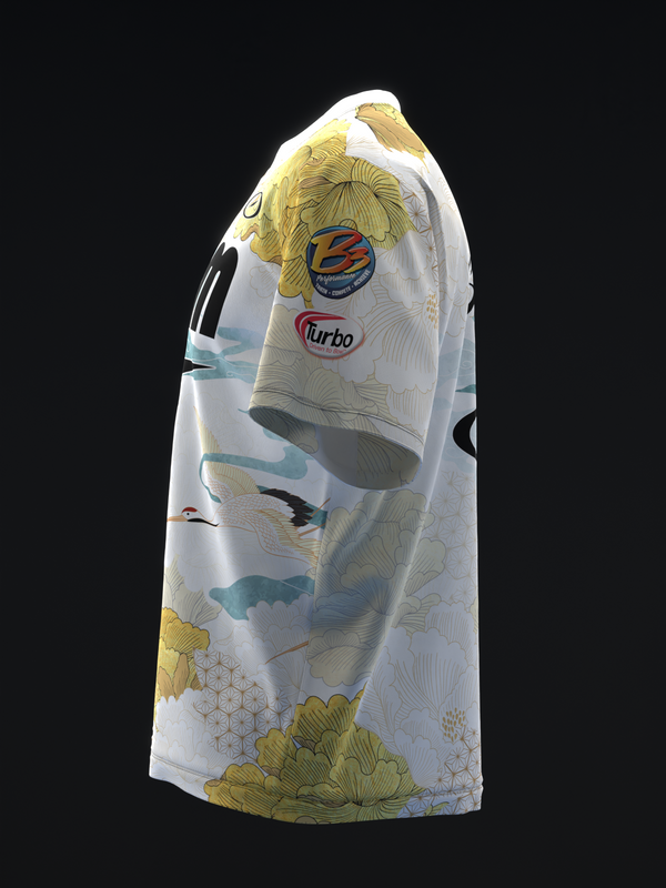 White bowling jersey with yellow cranes, fish, and floral pattern, front view