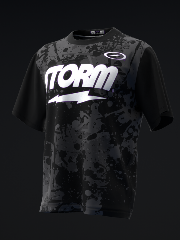 Black bowling jersey with white Storm text and splatter pattern design, front view