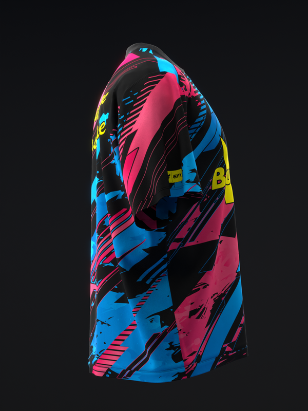 Black bowling jersey with bright pink, blue, and yellow abstract geometric pattern, side view
