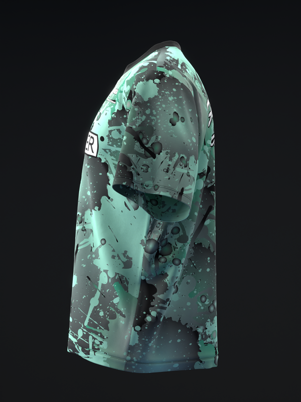 Green bowling jersey with black splatter and smoke pattern, side view