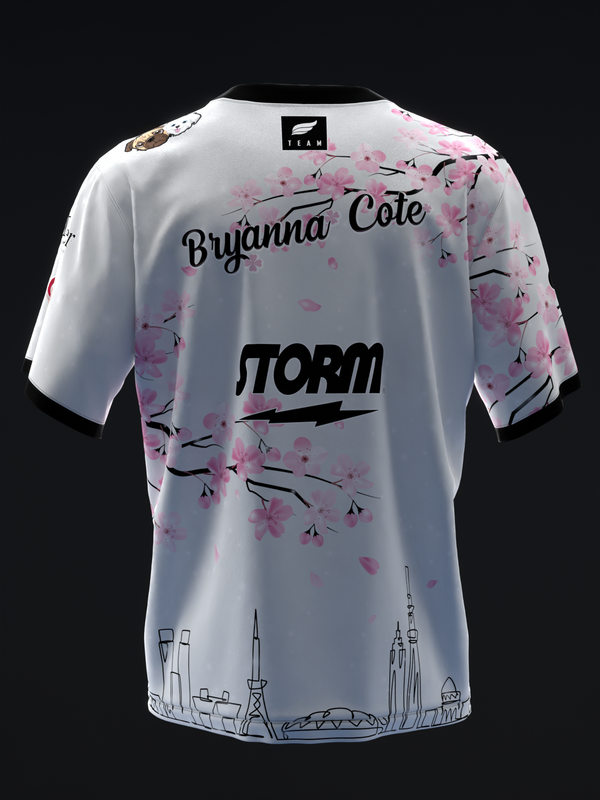 White bowling jersey with pink floral design and black text back view