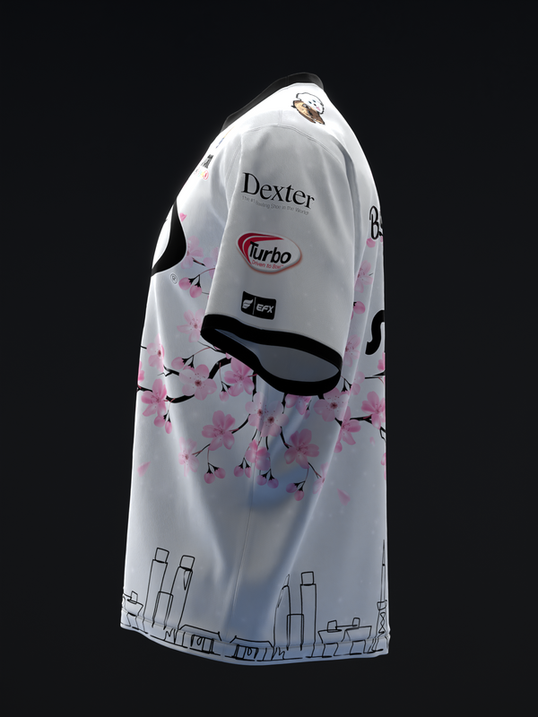White bowling jersey with pink floral design and city skyline graphic