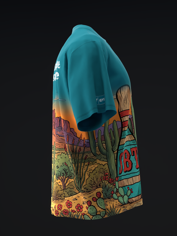 Teal bowling jersey with desert landscape graphic featuring cactus and wildflowers