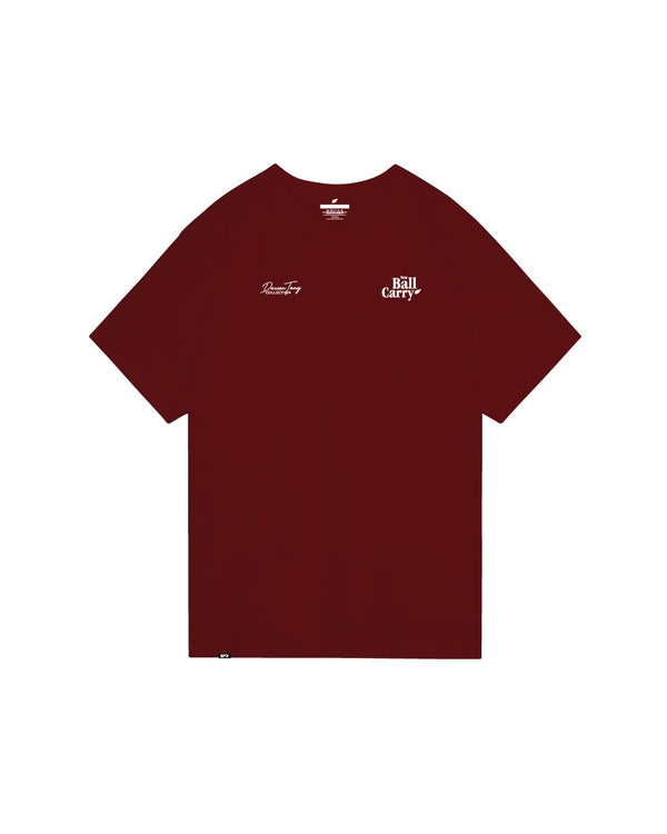 Burgundy bowling tee with small white text graphics on front chest area