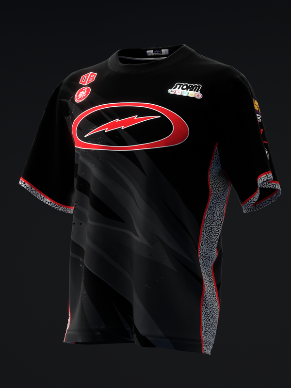 Black bowling jersey with red oval graphic, side texture panels, and brand logos