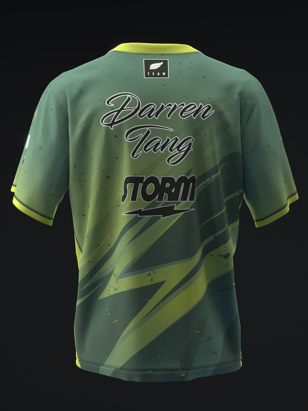 Back view of green bowling jersey with yellow lightning stripe design and text