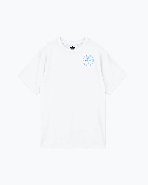 White t-shirt with small blue circular graphic on chest