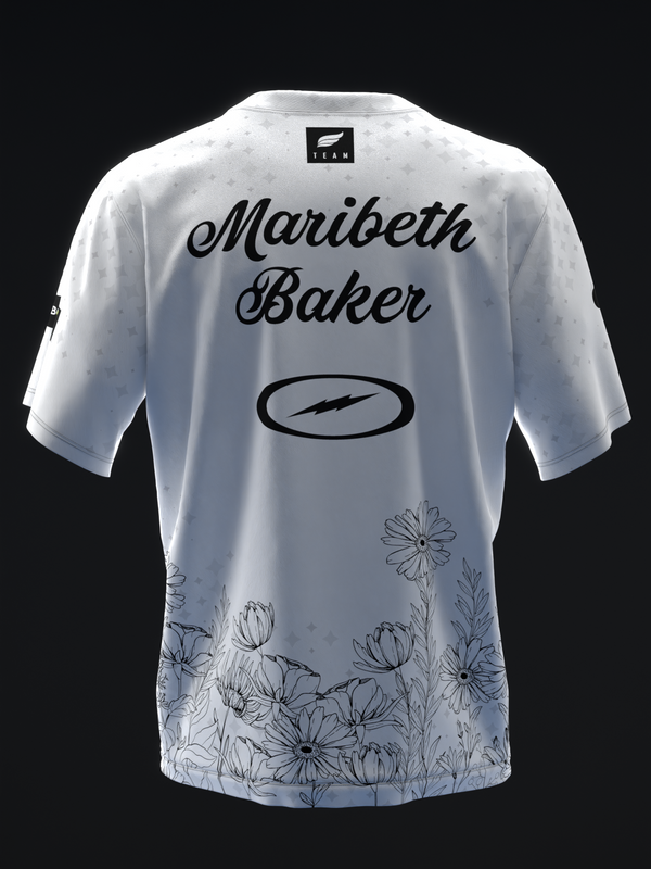 White bowling jersey with Maribeth Baker name and floral design at hem, back view