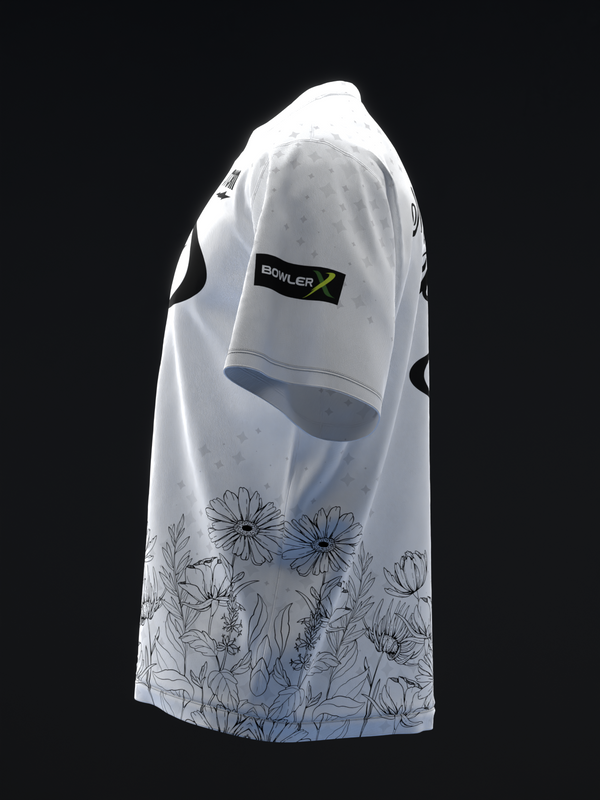White bowling jersey with floral and stem line drawings at hemline, side view