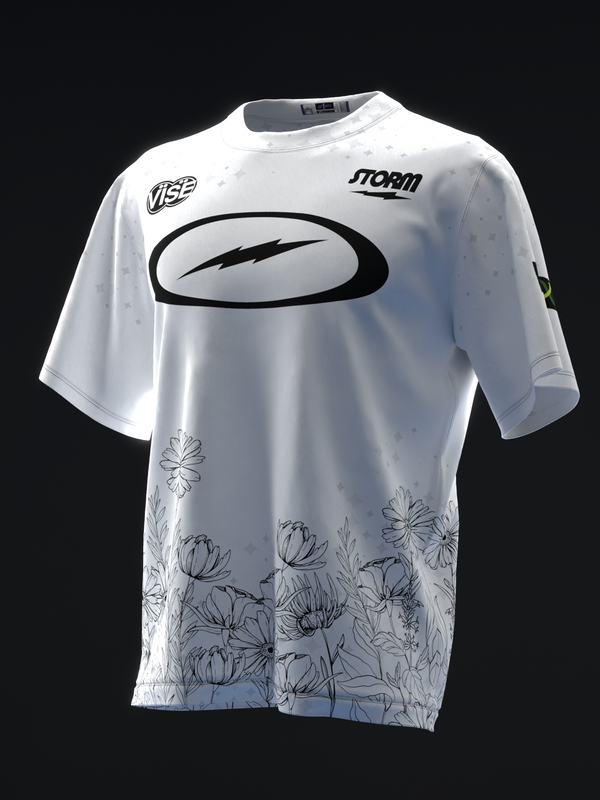 White bowling jersey with black oval logo and floral stem pattern at hem