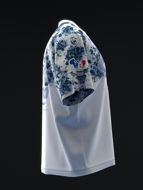 White bowling jersey with blue floral pattern on shoulder, side view