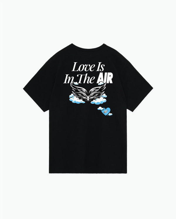 Black t-shirt with white text and winged graphic design on back