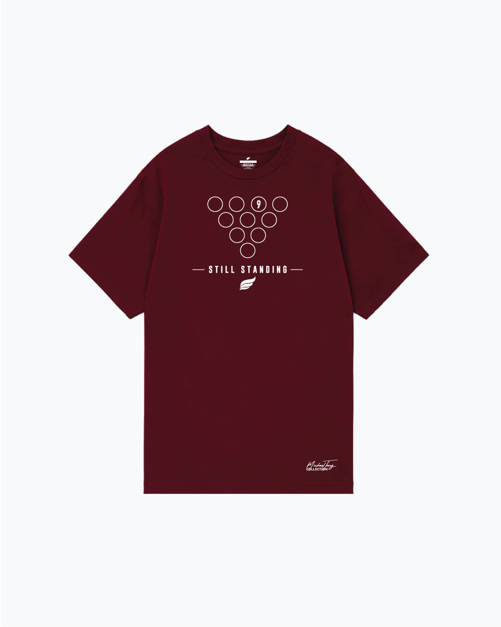 Burgundy t-shirt with bowling pin formation graphic and still standing text