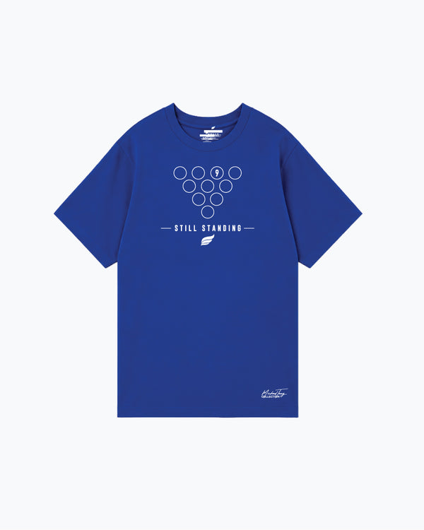 Royal blue bowling tee with outlined pin formation and still standing text