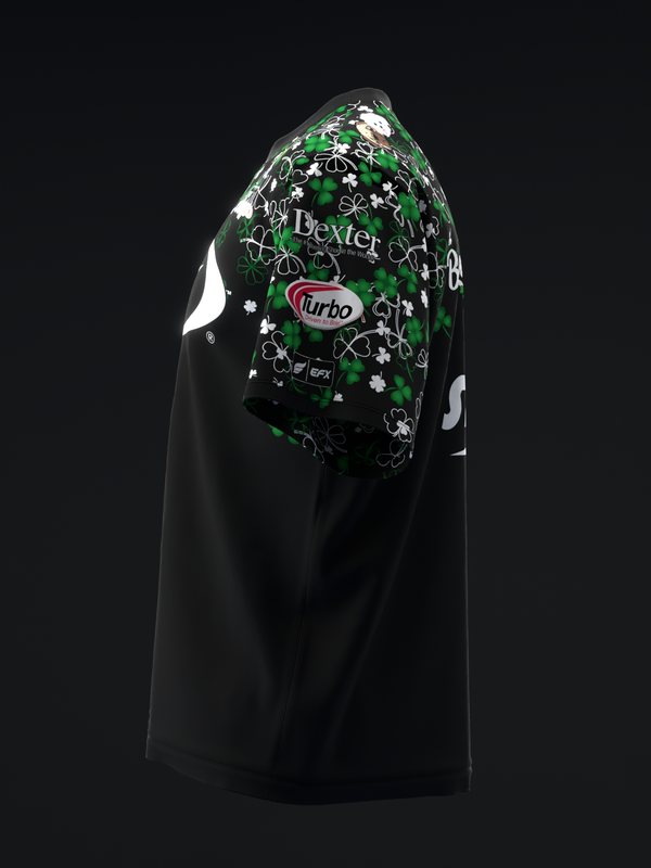 Black bowling jersey with green and white floral graphic back panel and Turbo logo