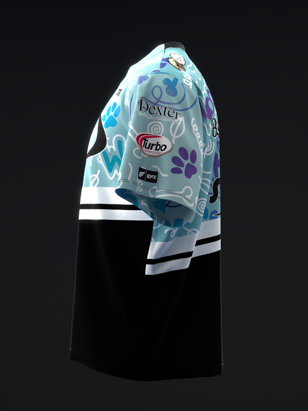 Light blue bowling jersey with colorful paw print pattern and brand logos, side view