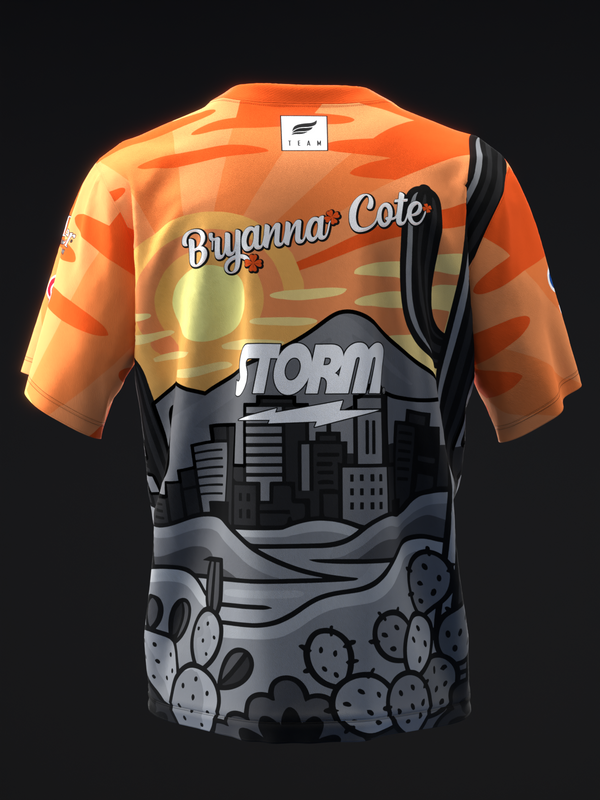 Orange and black bowling jersey with storm and desert landscape graphic, front view