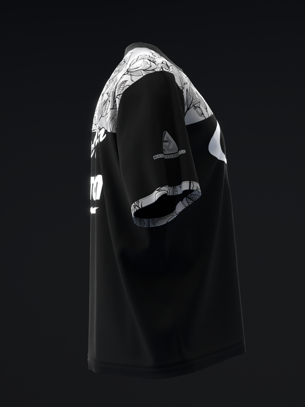 Black bowling jersey with white and silver floral graphic on shoulder, side view