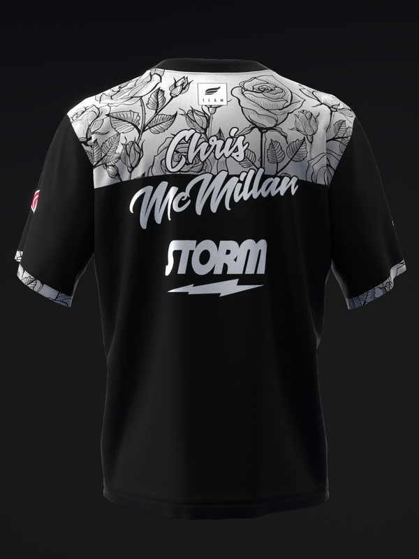 Black bowling jersey with floral graphic yoke and Chris Mcmillan Storm text