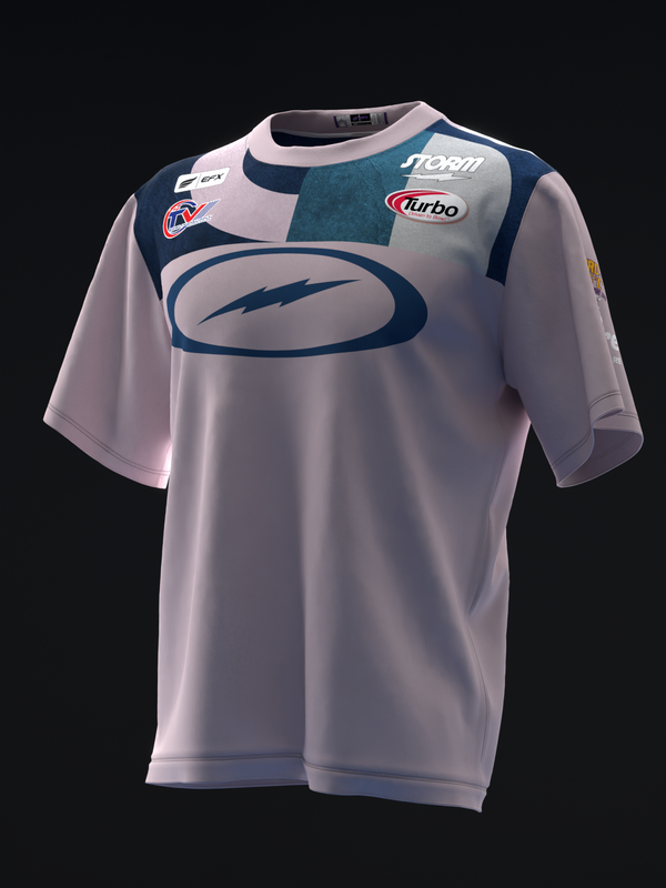Light pink bowling jersey with dark teal and navy color blocking and oval graphic on front