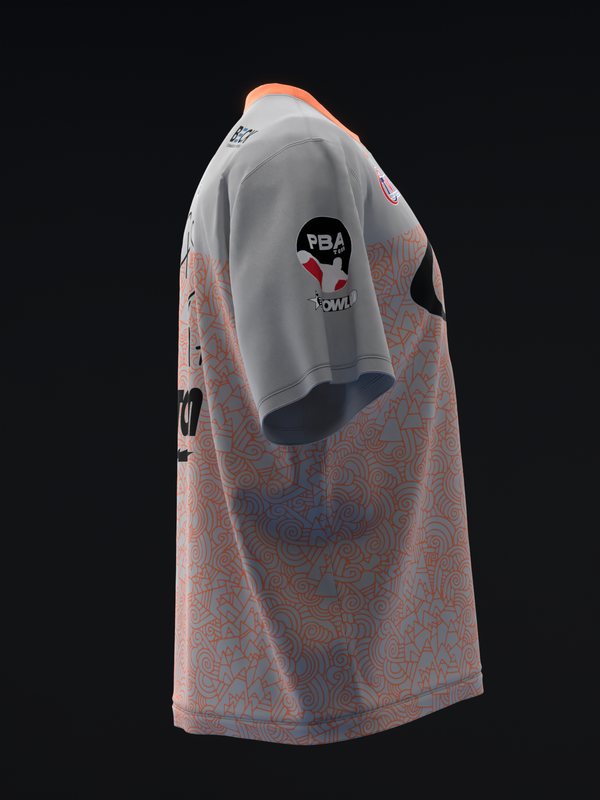 Bowling jersey with gray sleeves, coral and navy geometric pattern on body, side view