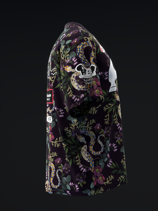 Black bowling jersey with colorful serpent and floral embroidered design, three-quarter view